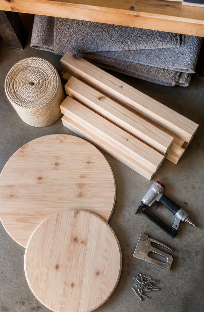 How to Build a DIY Cat Tree: 5 Plans for 2026 1 Pine rounds, sisal rope, and tools for building a cat tree.
